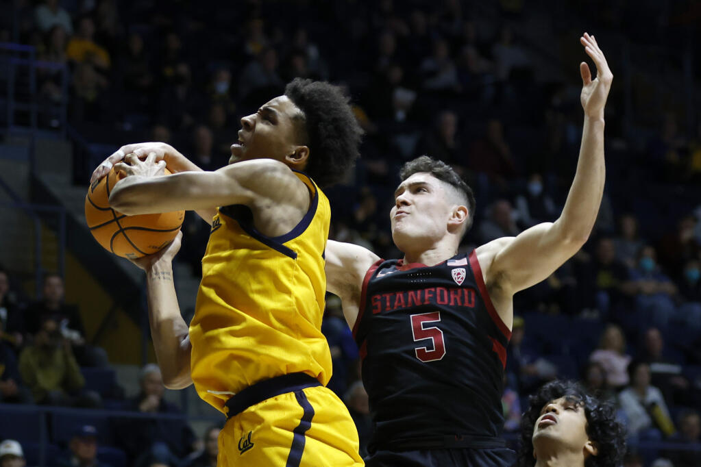 California forward Monty Bowser (2) is defended by Stanford guard Michael O'Connell (5) during the first half of an NCAA college basketball game in Berkeley, Calif., Friday, Jan. 6, 2023. (AP Photo/Jed Jacobsohn)