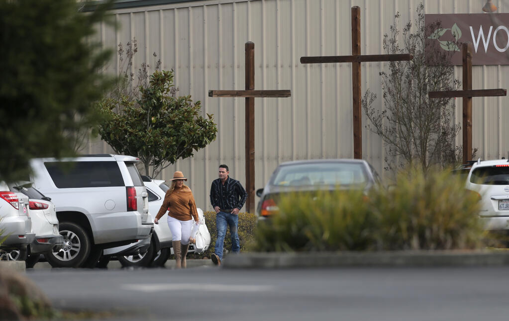 Congregants without face masks depart Spring Hills Church north of Santa Rosa following an afternoon worship service on Sunday, Jan. 24, 2021. The county’s code enforcement team has now fined the church three times for holding large, indoor services that violate the public health order. (The Press Democrat)