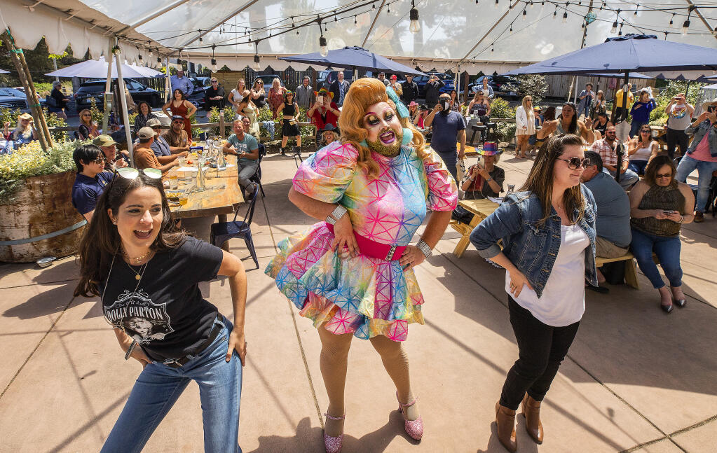 Performer Nia Politan dances the Macarena with members of the audience at the Dolly’d Up Drag Brunch at the William Tell House in Tomales on Sunday, May 29, 2021.  (John Burgess/The Press Democrat)