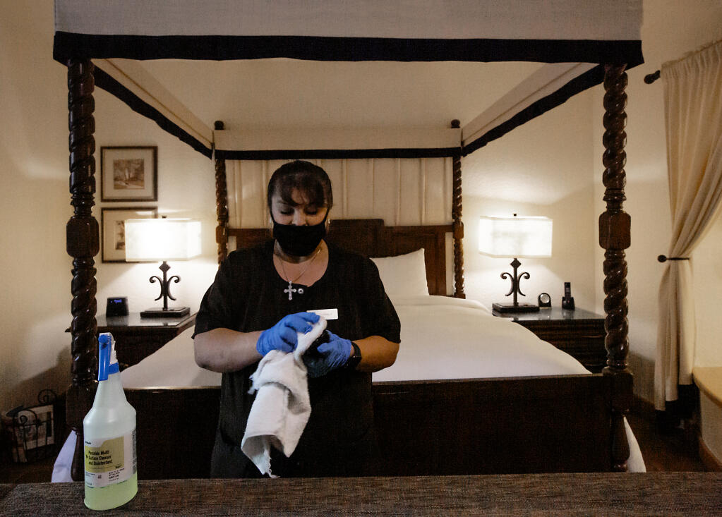 With many guests coming through, housekeeper Maria del Carmen Rodriguez is kept busy cleaning and disinfecting a suite at the Fairmont Sonoma Mission Inn in Boyes Hot Springs on Friday, August 13, 2021. (Photo by Robbi Pengelly/Index-Tribune)
