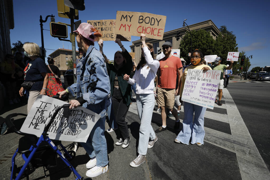 Supporters of reproductive rights march through downtown Petaluma, California, on Sunday, June 26, 2022. (Beth Schlanker/The Press Democrat)