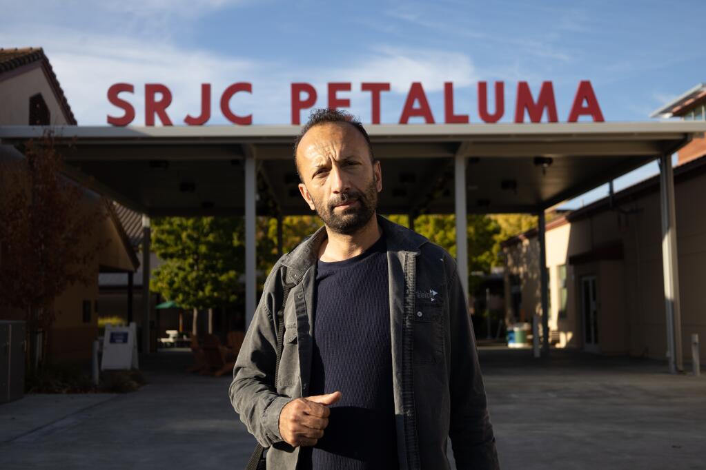 Mohammad Zahir Qaderi stands in front of the Welcome Center at Santa Rosa Junior College. The Qaderi family was one of eight families who were brought to Petaluma. As their one-year housing support expires, some of these families have to leave the area because of high rents. (Photo: Lina Hoshino)