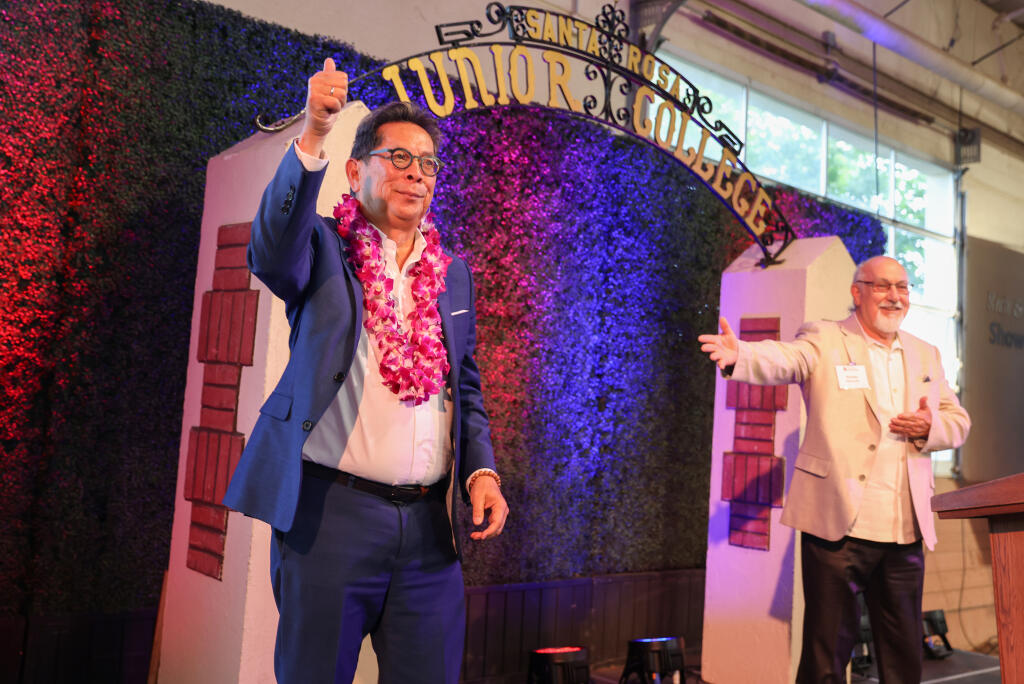 Outgoing SRJC President Dr. Frank Chong acknowledges the crowd, with Ricardo Navarrette, at his retirement event at Shone Farm near Forestville on Thursday, June 1, 2023. (Christopher Chung/The Press Democrat)