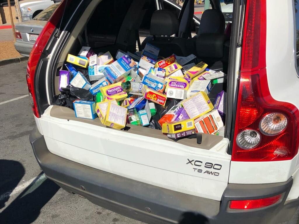 Windsor police found hundreds of boxes of unopened medication in a vehicle parked outside of Walmart on Tuesday, Oct. 12, 2021, and have arrested a woman on suspicion of burglary. Police are still looking for a man suspected in the burglary. (Windsor Police Department / Facebook)