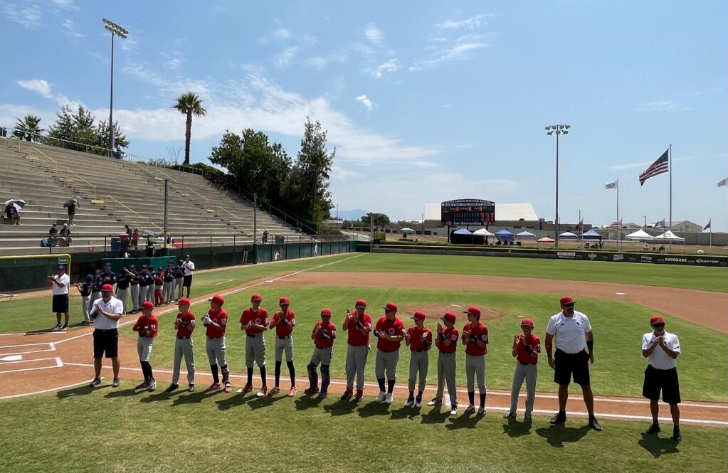Petaluma and Honolulu teams are introduced prior to their semifinal game in the Little League West Region Tournament. (ESTHER OKAMURA PHOTO)
