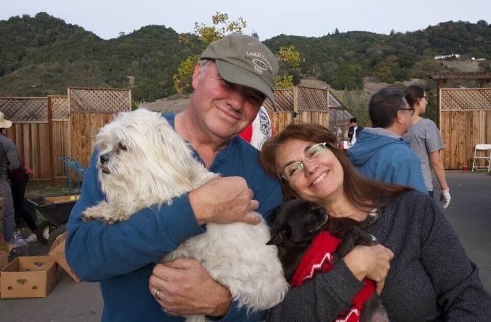 Larry Atchison with his wife Cecilia Gachet-Atchison and their two dogs, JoJo and Zoe. (Provided by Pierre Gachet)