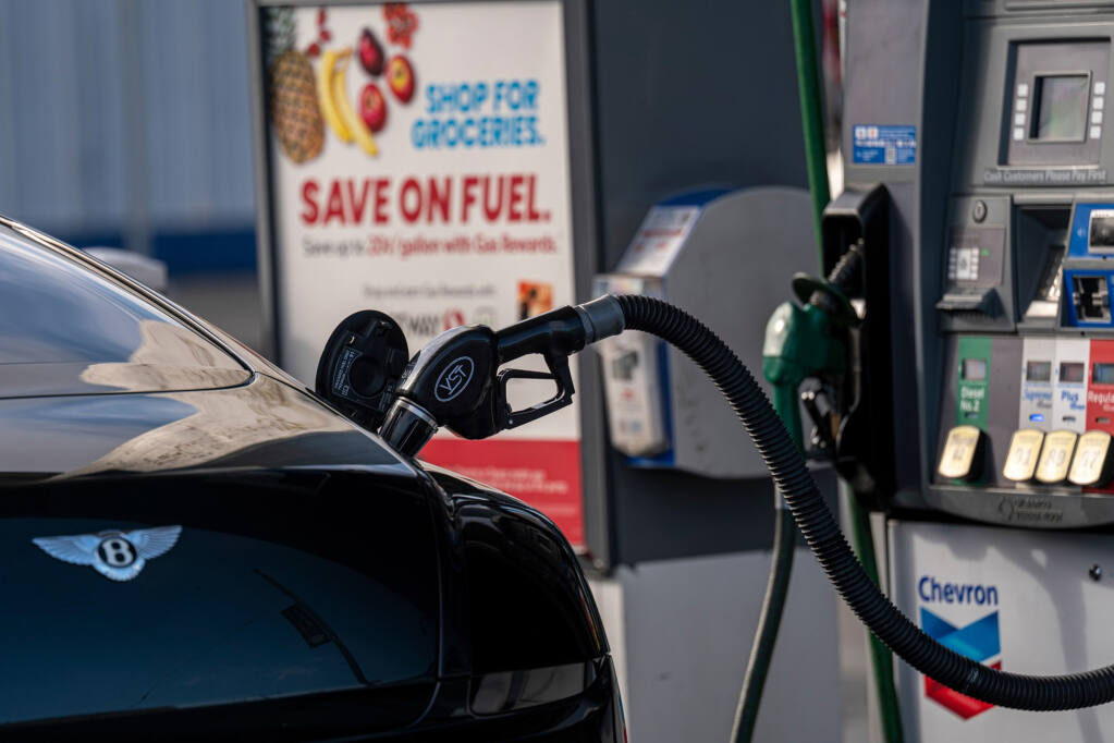 A fuel nozzle in vehicle at a Chevron gas station March 29, 2022, in San Francisco. (David Paul Morris / Bloomberg)