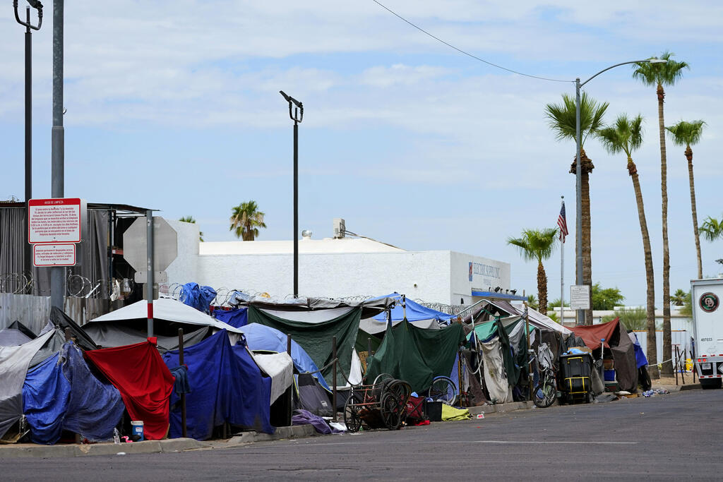 Tents line the street of "the Zone," a homeless encampment  in Phoenix.  (MATT YORK / Associated Press)