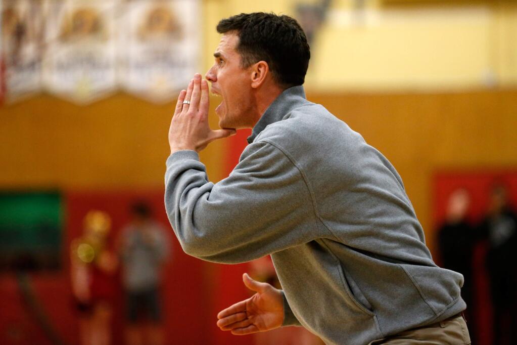 Windsor head coach Travis Taylor shouts instructions to his players from the sideline during the first half of a boys varsity basketball game between Windsor and Cardinal Newman high schools, in Santa Rosa, California, on Wednesday, January 13, 2016. (Alvin Jornada / The Press Democrat)