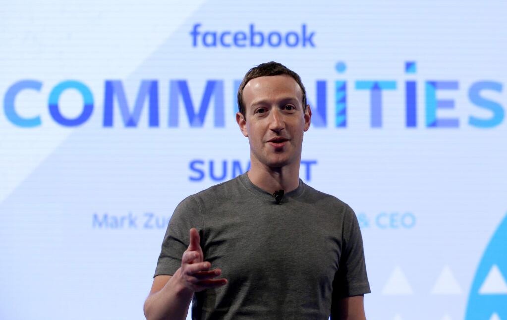FILE - In this Wednesday, June 21, 2017, file photo, Facebook CEO Mark Zuckerberg speaks as he prepares for the Facebook Communities Summit in Chicago. (AP Photo/Nam Y. Huh, File)
