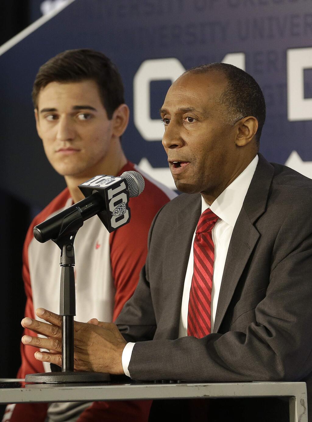 Stanford head coach Johnny Dawkins, right, speaks next to Rosco Allen during Pac-12 media day in San Francisco, Thursday, Oct. 15, 2015. (AP Photo/Jeff Chiu)