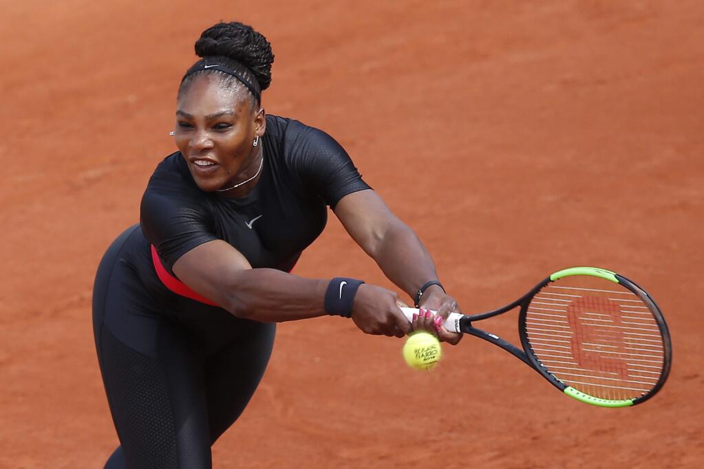 FILE - In this May 29, 2018, file photo, Serena Williams returns a shot against Krystyna Pliskova during their first-round match of the French Open tennis tournament in Paris, France. The women's tennis tour has approved rule changes that involve seedings after a return from pregnancy. Former No. 1 players Williams and Victoria Azarenka are recent mothers on the tour. (AP Photo/Michel Euler, File)