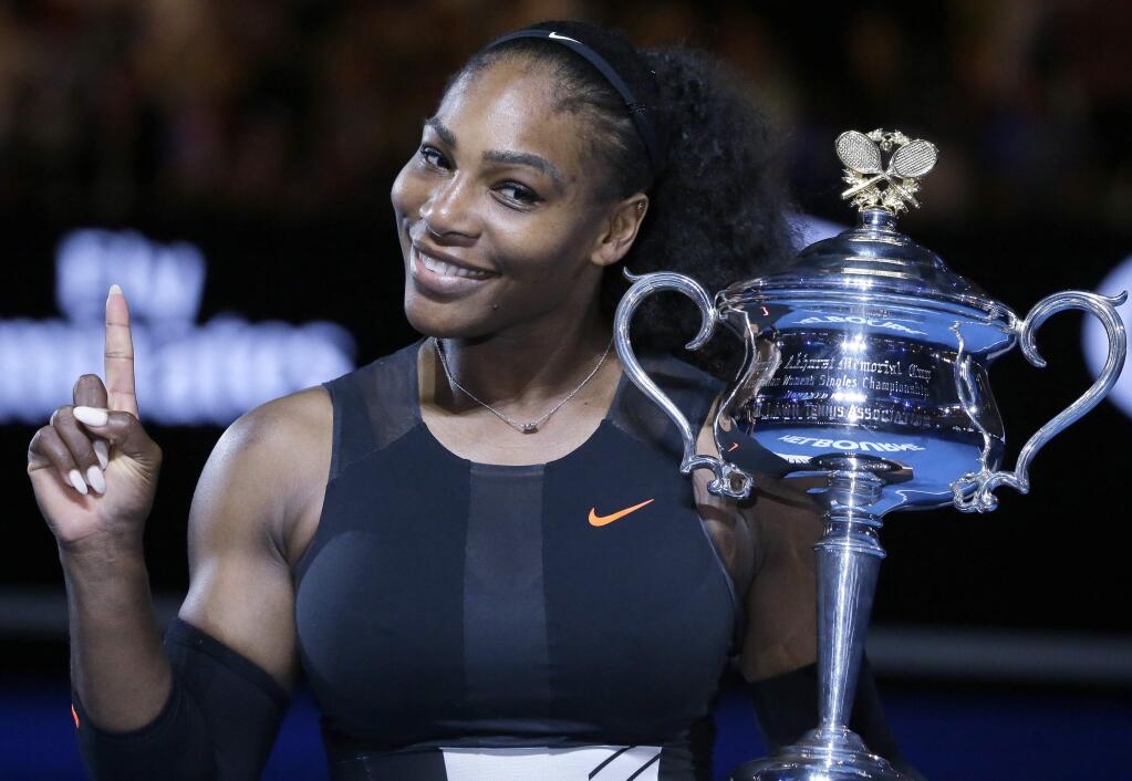 FILE - In this Jan. 28, 2017, file photo, Serena Williams holds up a finger and her trophy after defeating her sister, Venus, in the women's singles final at the Australian Open tennis championships in Melbourne, Australia. Serena Williams is briefly back at No. 1 in the WTA rankings, despite not having played a match since January, and with plans to take the rest of 2017 off because she is expecting a baby. Thanks to a calendar quirk, Williams moved up one spot from No. 2, swapping places with Angelique Kerber. (AP Photo/Aaron Favila, File)
