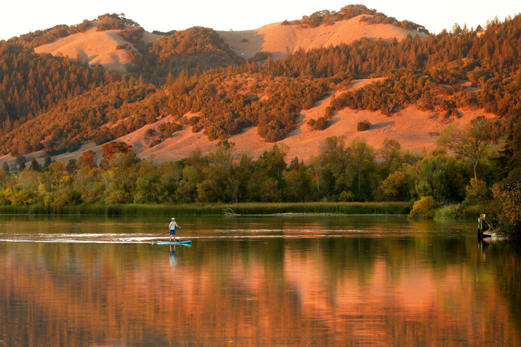 A paddleboarder rows around Spring Lake in Santa Rosa in 2018. (Alvin A.H. Jornada / The Press Democrat)