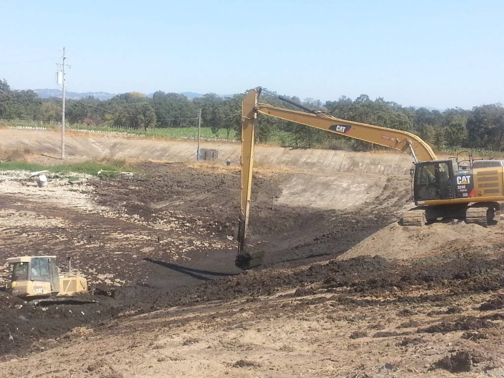 PHOTO: 1 by KEVIN McCALLUM / The Press DemocratExcavators and bulldozers are clearing two massive lagoons of ?manure at the 177-acre Ocean View Dairy, nestled between the Charles M. Schulz-Sonoma County Airport and the Russian River.