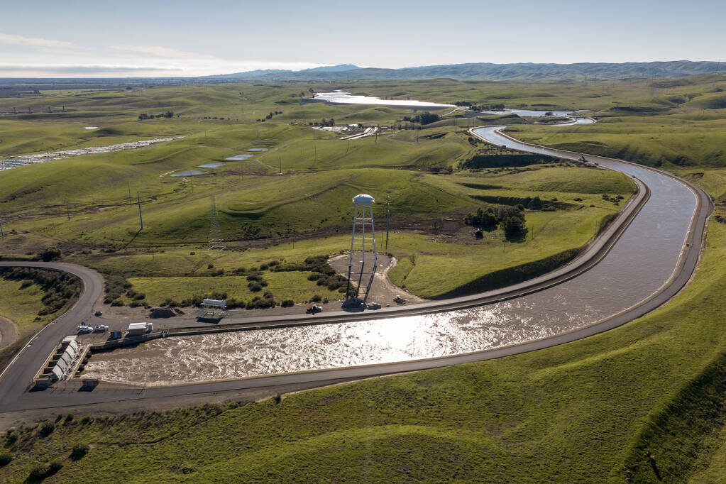 A drone provides a view of water pumped from the Harvey O. Banks Delta Pumping Plant into the California Aqueduct at 9,790 cubic feet per second after January storms. The facility located in Alameda County and lifts water into the California Aqueduct. Jan. 20, 2023. Photo by Ken James, California Department of Water Resources
