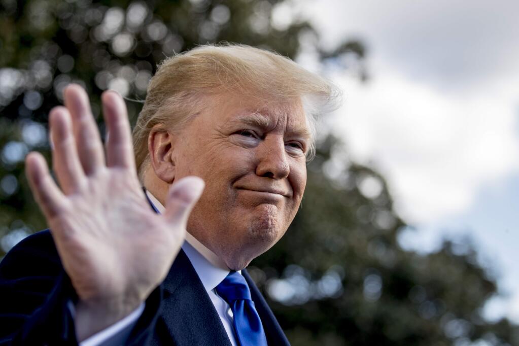 President Donald Trump smiles while speaking to reporters on the South Lawn of the White House in Washington, Friday, Nov. 8, 2019, before boarding Marine One for a short trip to Andrews Air Force Base, Md. and then on to Georgia to meet with supporters. (AP Photo/Andrew Harnik)