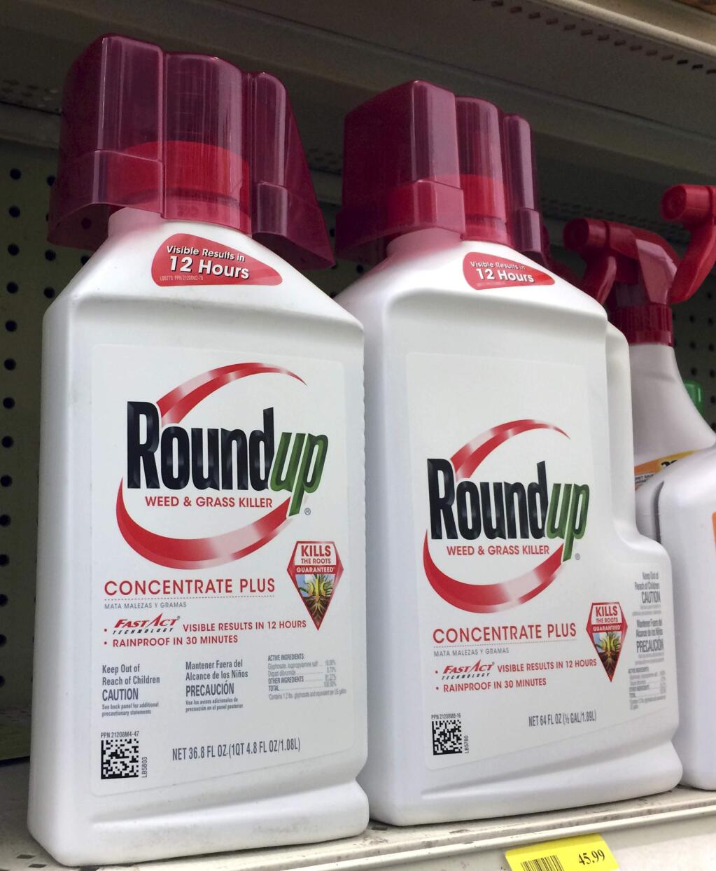 Containers of Roundup a weed killer is seen on a shelf at a hardware store in Los Angeles on Thursday, Jan. 26, 2017. A battle over the main ingredient in Roundup, the popular weed killer sprayed by farmers and home gardeners worldwide, is coming to a head in California, where officials want to be the first to label the chemical, glyphosate, with warnings that it could cause cancer. Chemical giant Monsanto has sued the nation's leading agricultural producer, saying state officials illegally based their decision for warning labels on an international health organization. (AP Photo/Reed Saxon)