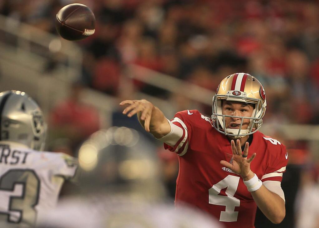 During his first start as quarterback, Nick Mullens throws for a first down in the red zone during the 49ers 34-3 win over the Raiders, Thursday Nov. 1, 2018 in Santa Clara. (Kent Porter / The Press Democrat) 2018