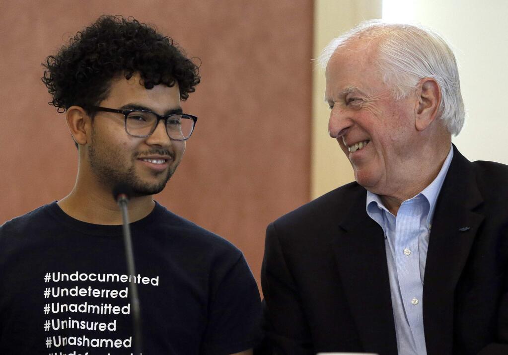 Rep. Mike Thompson, D-Calif., right, smiles while speaking to DACA recipient and Santa Rosa Junior College student Laith Ocean during a town hall meeting on the campus Wednesday, Sept. 20, 2017, in Santa Rosa, California. (AP Photo/Ben Margot)