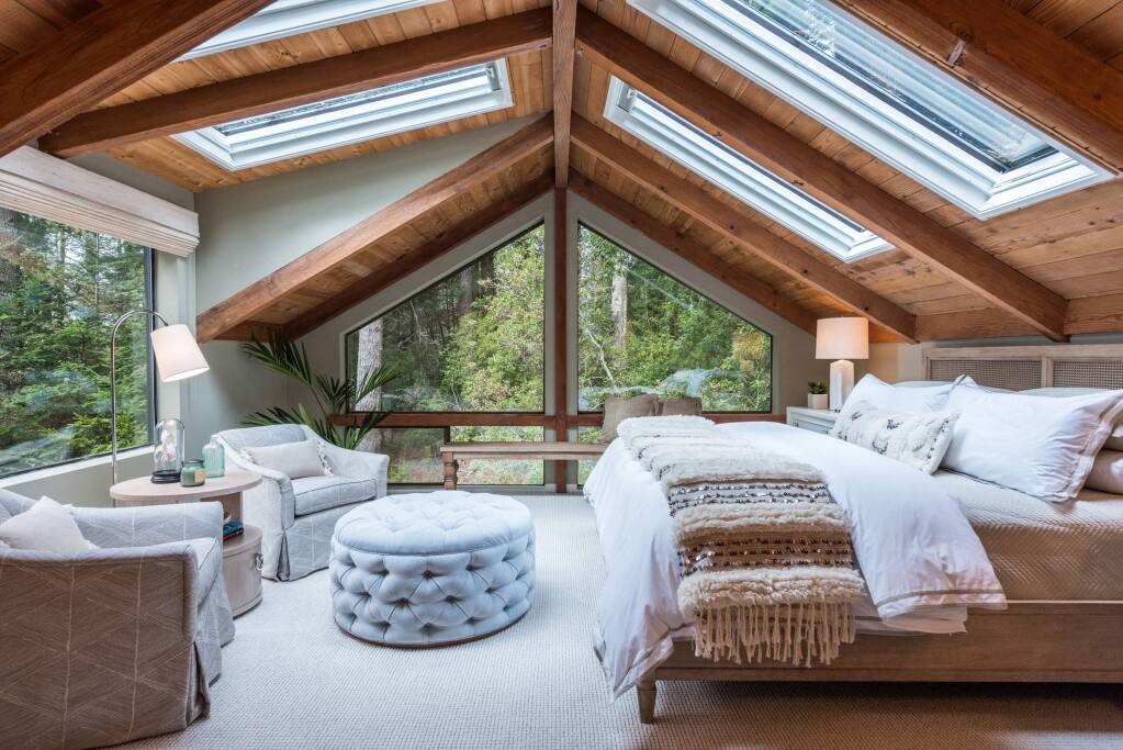Meredith Gilardoni PhotographyAn interior redesign at a Sea Ranch vacation house on Timber Ridge Road included this upper floor bedroom with plenty of windows.