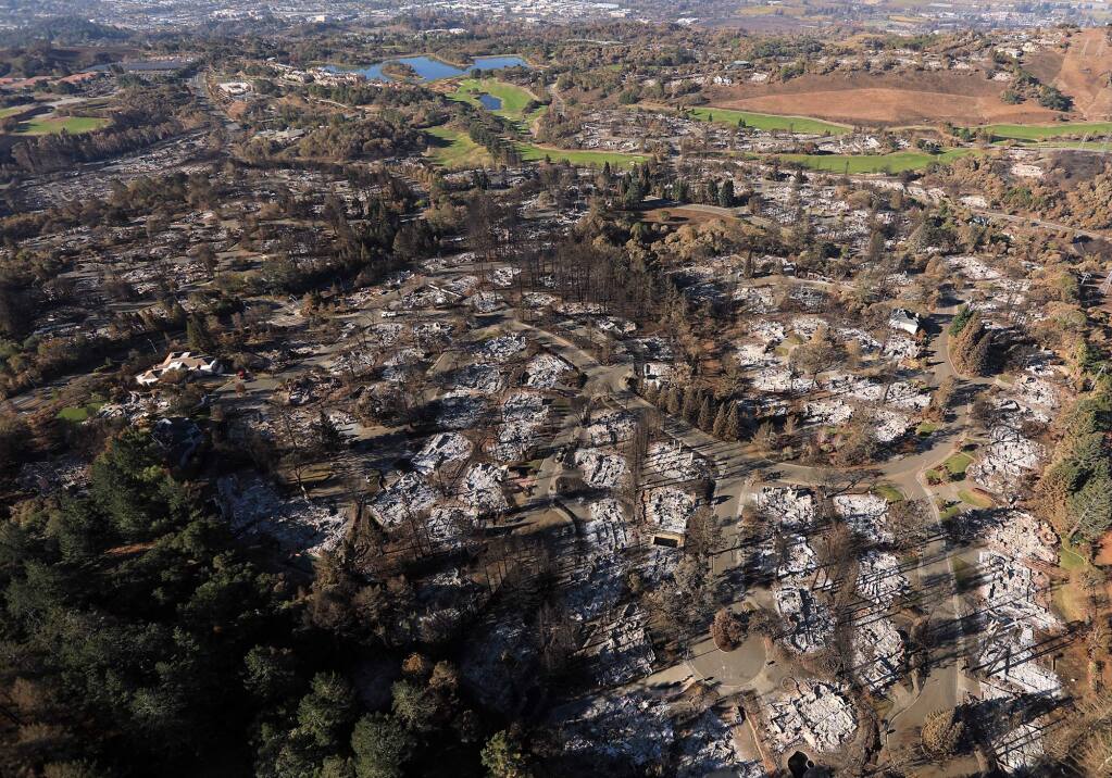 Fountaingrove at Fir Ridge, Parker Hill with the Fountaingrove Golf Course in the background, and Skyfarm at right, top, Wednesday Oct. 25, 2017, all razed due to the Tubbs fire. (Kent Porter / Press Democrat) 2017
