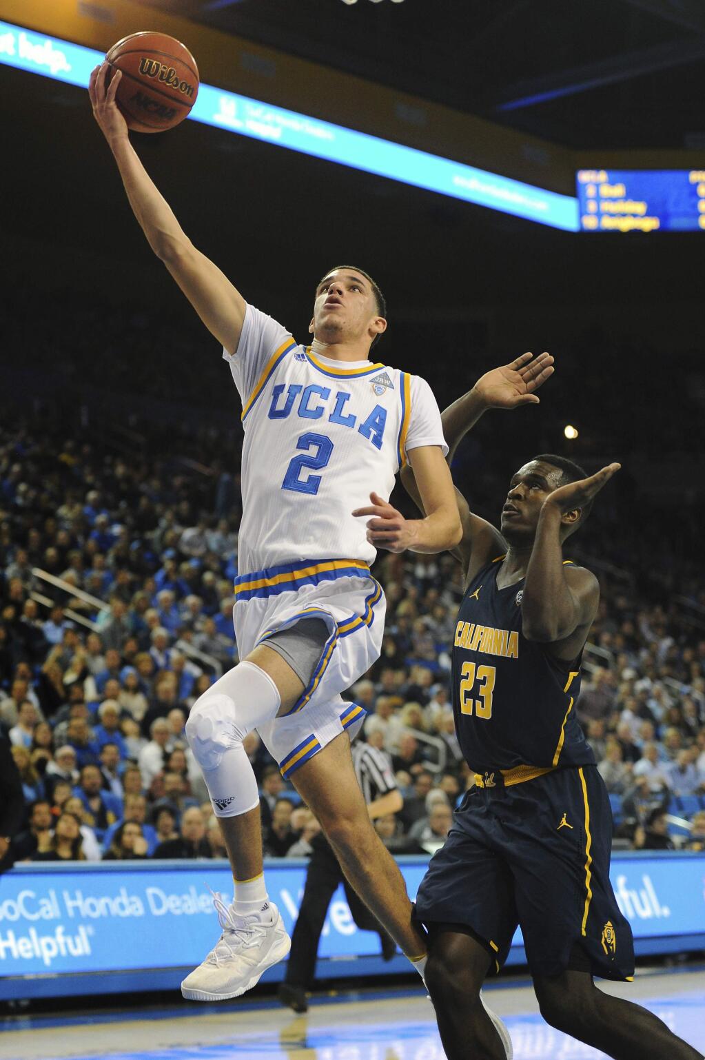 UCLA guard Lonzo Ball goes for a fast break past California's Jabari Bird during the first half of an NCAA college basketball game in Los Angeles, Thursday, Jan. 5, 2017. (AP Photo/Michael Owen Baker)