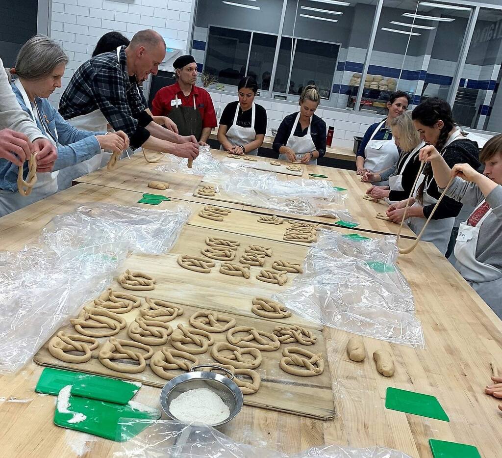 Learning to flip the dough into a pretzel shape takes a few tries. (Houston Porter/For the Argus-Courier)