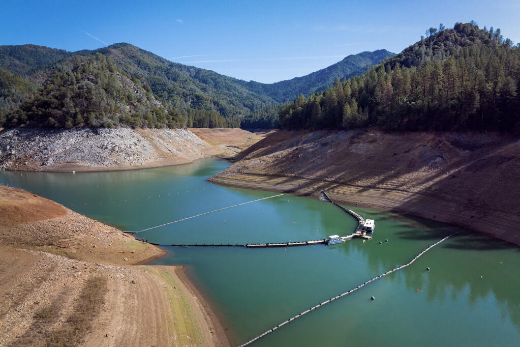 A collection system is set up at Dekkas Rock at Shasta Lake. The pilot project will evaluate the  viability of collecting juvenile salmon as they migrate out of the McCloud River upstream of Shasta Dam. Photo by Florence Flow, California Department of Water Resources