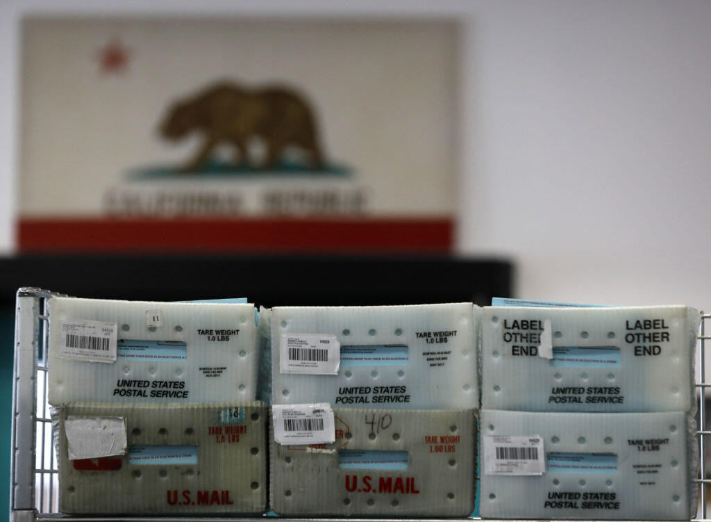 Boxes of Vote-by-Mail ballots sit sorted, but yet to be counted at the Sonoma County Registrar of Voters Office on Wednesday, November 7, 2018 in Santa Rosa, California . (BETH SCHLANKER/The Press Democrat)
