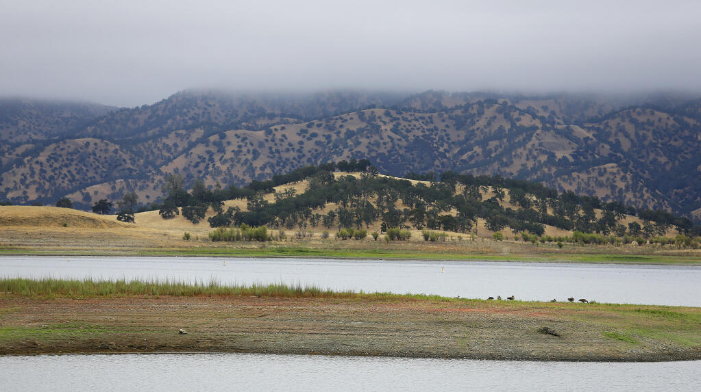 FILE - Lake Berryessa is seen with parts of California's newest national monument in the background, July 10, 2015, near Berryessa Snow Mountain National Monument, Calif. President Biden has expanded two culturally significant California landscapes: the San Gabriel Mountains National Monument in Southern California and Berryessa Snow Mountain National Monument in Northern California. The U.S. National Park Service notes that the move Thursday, May 2, 2024 was allowed under the Antiquities Act of 1906. (AP Photo/Eric Risberg)