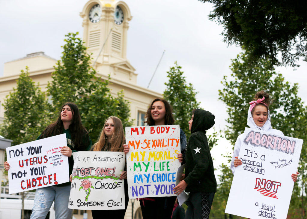 Taylor Wall, 16, far left, Ceili Manning, 17, Eden Keys, 17, Walker Keys, 12, and Sofia Johansen, 16, join the Stop the Ban rally against the anti-abortion laws being passed in other states, at Old Courthouse Square in Santa Rosa, California, on Tuesday, May 21, 2019. (Alvin Jornada / The Press Democrat)