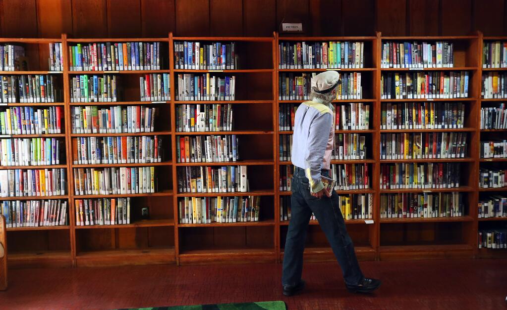 Jay Hirschman browses at the Occidental branch of the Sonoma County Library. (JOHN BURGESS / The Press Democrat, 2015)