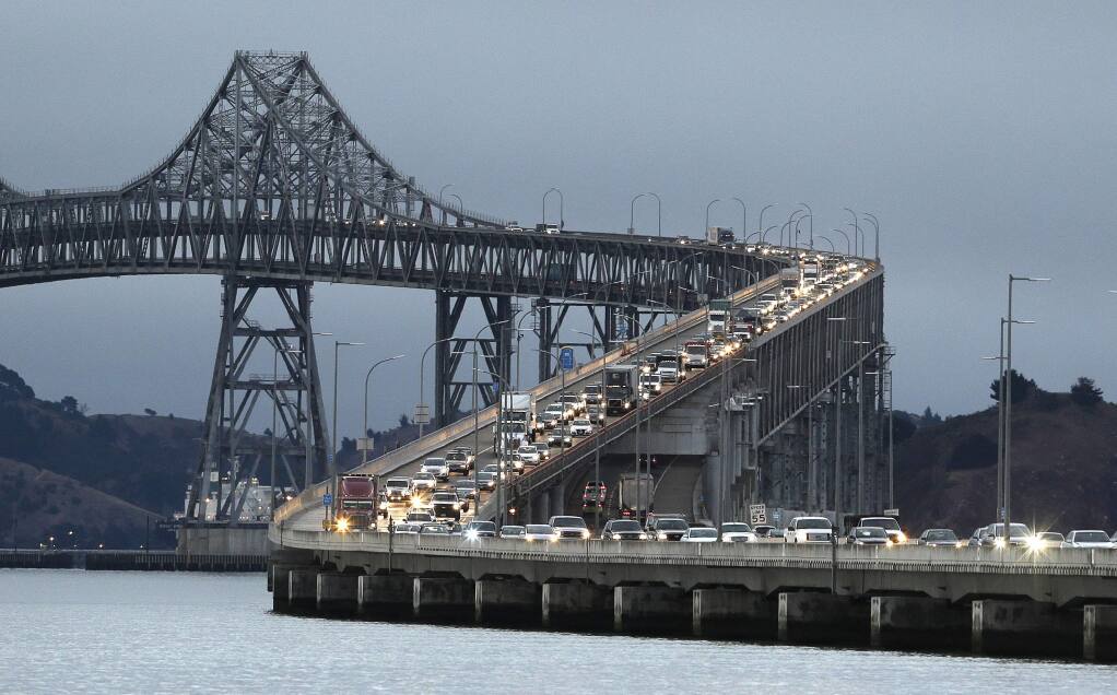 Traffic slows in the morning commute over the Richmond-San Rafael Bridge during the shutdown of the San Francisco-Oakland Bay Bridge Thursday, Aug. 29, 2013, in San Rafael, Calif. Commuters faced their first morning on Thursday without the bridge, but there weren't major traffic snarls as day broke across the Bay Area. Alternate bridges to get into San Francisco were more crowded around 6:30 a.m., and Bay Area Rapid Transit trains appeared to be carrying a heavier load than usual. But commuters were managing to get around. (AP Photo / Eric Risberg)