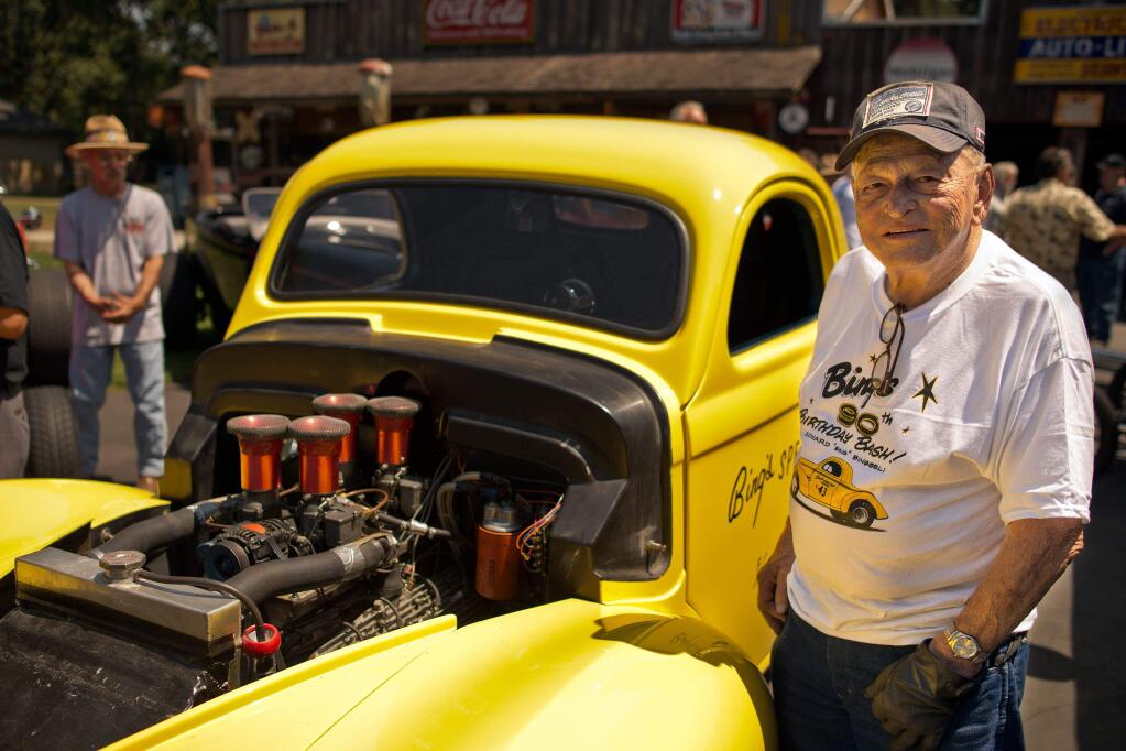 Ed 'Bing' Binggeli stands beside the 1941 Willys coupe he built after unveiling the car and its 1941 Ford Flathead engine during his 90th birthday party at Stoke Ranch in Santa Rosa in 2013. (PD FILE)
