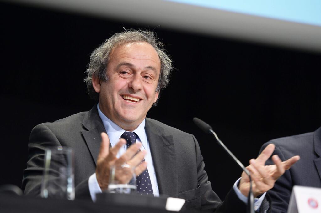 FILE - In this May 28, 2015 file picture, UEFA-President Michel Platini speaks during a news conference after a meeting of the European Soccer federation UEFA in Zurich, Switzerland. Michel Platini has launched his campaign to succeed Sepp Blatter as FIFA president, aiming to give the scandal-hit governing body 'the dignity and the position it deserves.' Platini, the UEFA president and a FIFA vice president, wrote to member federations in Europe on Wednesday July 29, 2015 saying he will stand in the election and is counting on their support. (Walter Bieri/Keystone via AP,file)