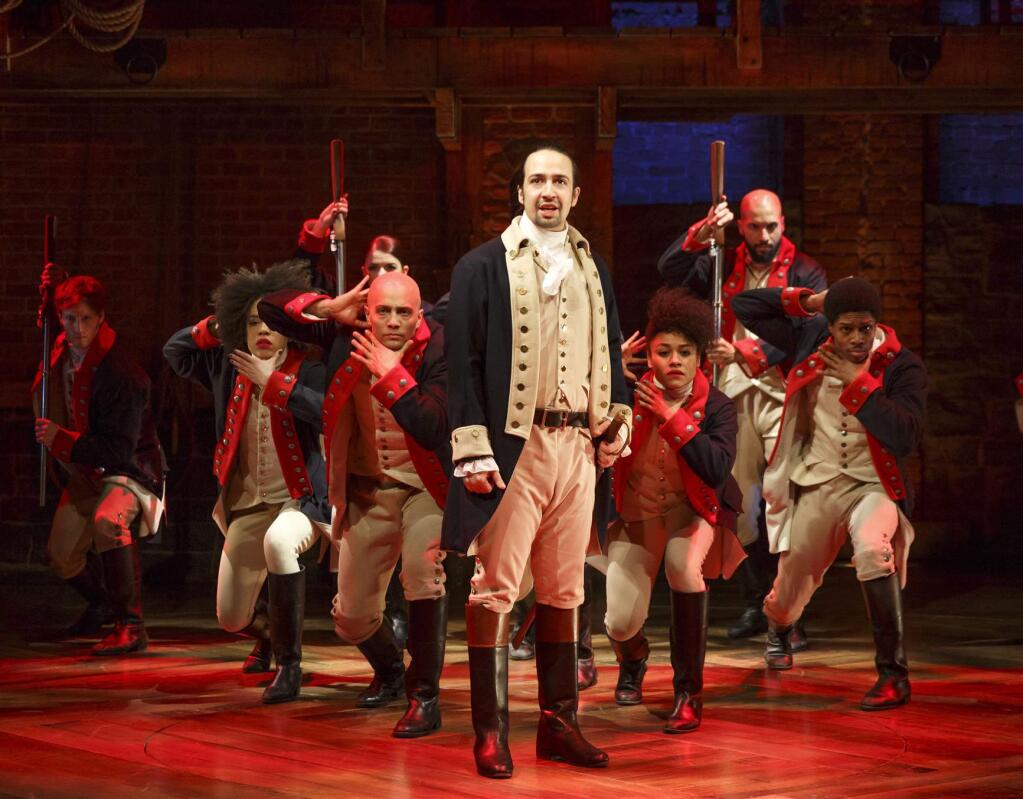This image released by The Public Theater shows Lin-Manuel Miranda, foreground, with the cast during a performance of 'Hamilton,' in New York. (Joan Marcus/The Public Theater via AP)