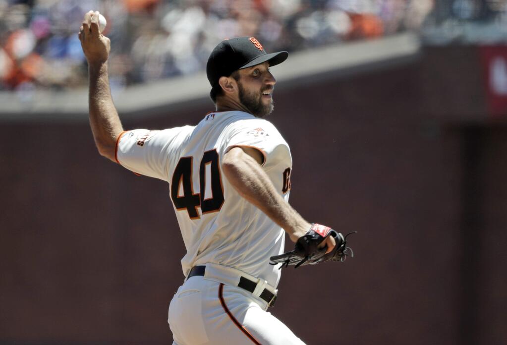 San Francisco Giants starting pitcher Madison Bumgarner throws to the St. Louis Cardinals during the first inning of a baseball game Sunday, July 8, 2018, in San Francisco. (AP Photo/Marcio Jose Sanchez)