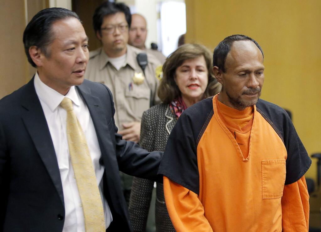 FILE - In this July 7, 2015 file photo, Jose Ines Garcia Zarate, right, is led into the courtroom by San Francisco Public Defender Jeff Adachi, left, and Assistant District Attorney Diana Garciaor, center, for his arraignment at the Hall of Justice in San Francisco. (Michael Macor/San Francisco Chronicle via AP, Pool, File)