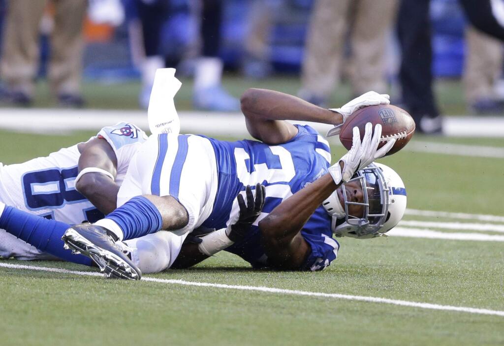 The Indianapolis Colts' Rashaan Melvin (30) makes an interception during the first half against the Tennessee Titans, Sunday, Nov. 26, 2017, in Indianapolis. (AP Photo/Michael Conroy)