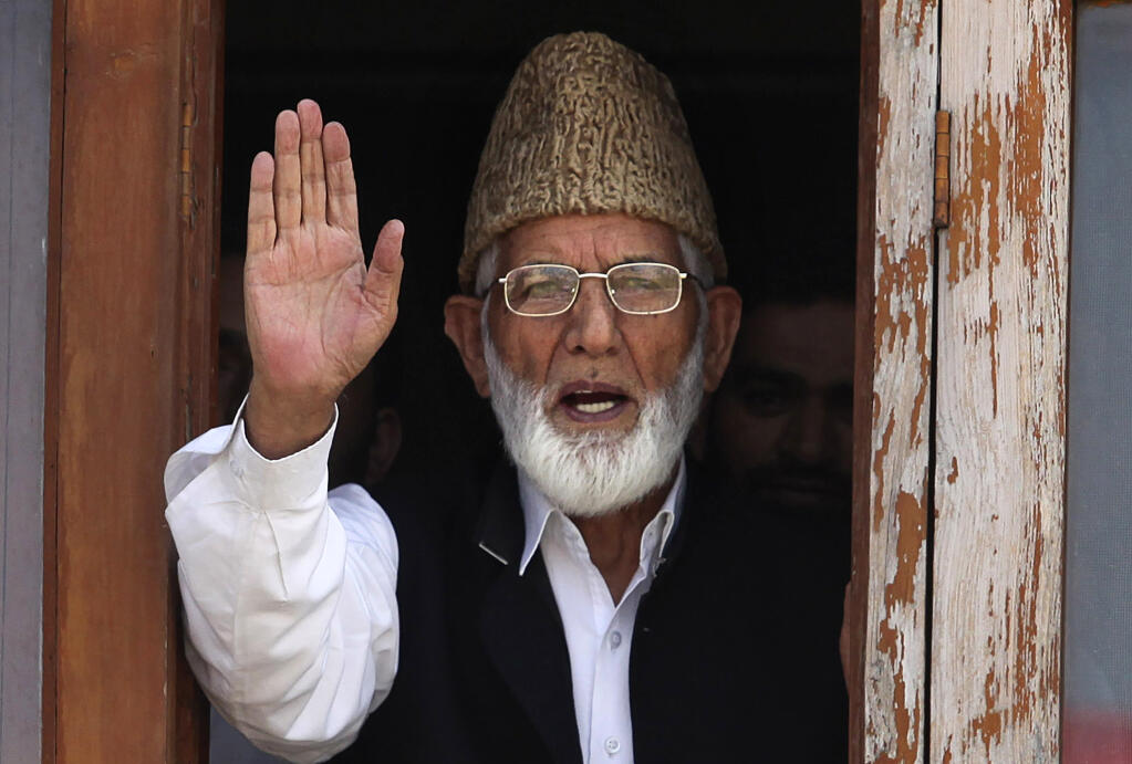 Kashmiri separatist leader Syed Ali Shah Geelani gestures as he speaks to media before his arrest in Srinagar, India, Wednesday, Sept. 8, 2010. Police in Indian-controlled Kashmir arrested Geelani Wednesday in an attempt to stop protests against Indian rule in the disputed region. (AP Photo/Altaf Qadri)