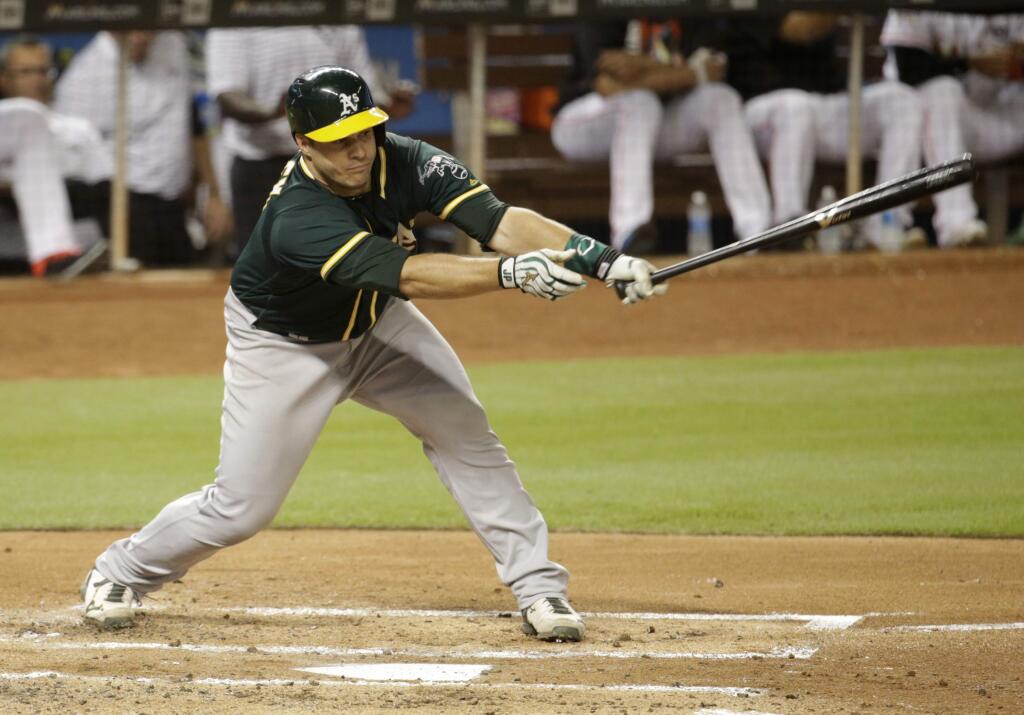 The Oakland Athletics' Josh Phegley strikes out swinging with the bases loaded during the second inning against the Miami Marlins, Tuesday, June 13, 2017, in Miami. (AP Photo/Lynne Sladky)