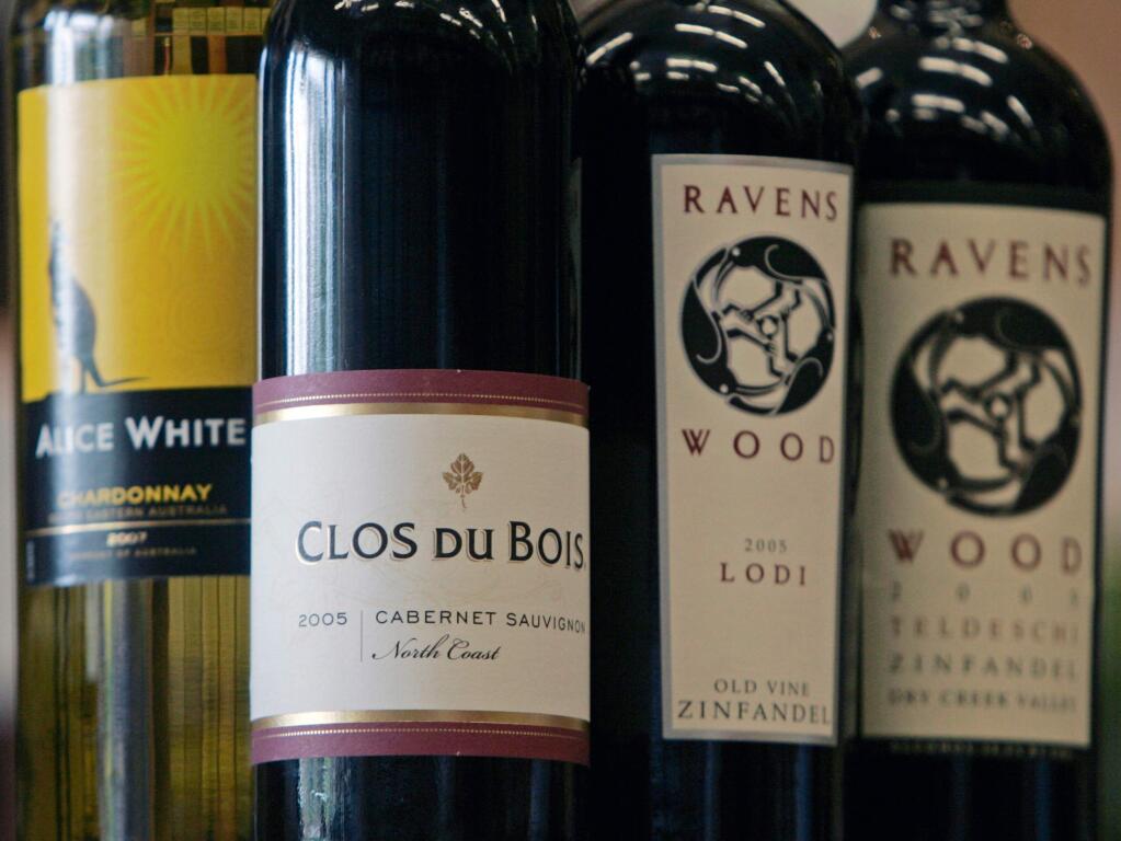 FILE - In this July 1, 2008 file photo, bottles of Clos Du Bois, Ravens Wood and Alice White, wines in the Constellation Brands, are seen at Empire Wine and Liquor Outlet in Colonie, N.Y. Constellation Brands Inc., which markets Mondavi wine, Svedka vodka and Corona beer, said Thursday, Jan. 7, 2010, its third-quarter profit fell 47 percent on restructuring-related costs and weaker U.S. wine sales. (AP Photo/Mike Groll, File)