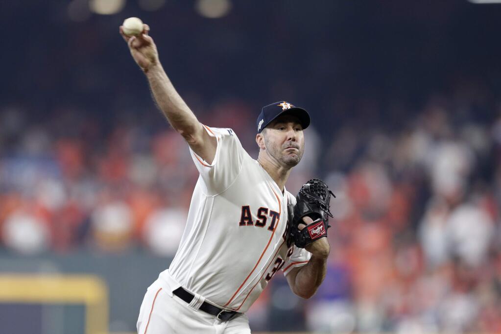 Houston Astros starting pitcher Justin Verlander (35) delivers a pitch against the Tampa Bay Rays in the first inning during Game 1 of a best-of-five American League Division Series baseball game in Houston, Friday, Oct. 4, 2019. (AP Photo/Michael Wyke)
