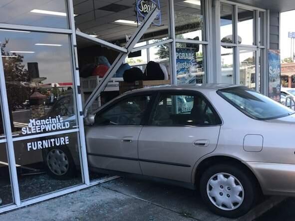 A driver crashed through the glass storefront of Mancini's Sleepworld store on South McDowell Boulevard, Sunday, June 17, 2018. (COURTESY OF PETALUMA POLICE DEPARTMENT)