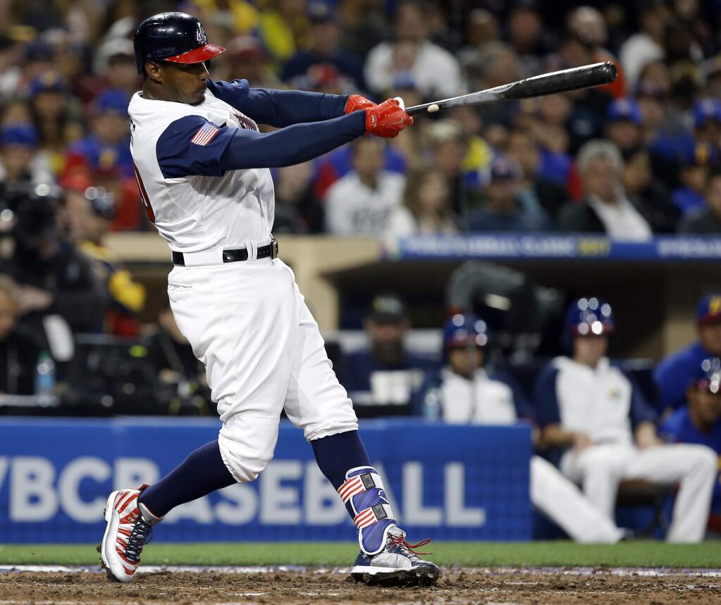 United States' Adam Jones follows through on a solo home run during the eighth inning of a second-round World Baseball Classic game against Venezuela in San Diego, Wednesday, March 15, 2017. The United States won 4-2. (AP Photo/Alex Gallardo)
