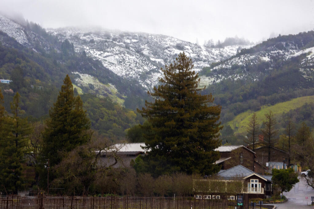 Snow-covered hills behind Kenwood Winery on Highway 12 on Friday, Feb. 24, 2023. (Robbi Pengelly/Index-Tribune)