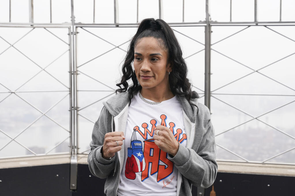 Boxer Amanda Serrano poses for a picture on the observation deck of the Empire State Building in New York on Tuesday, April 26, 2022. Serrano and Katie Taylor will become the first two female fighters to headline a boxing match at Madison Square Garden when they fight on Saturday for the World Lightweight title. (Seth Wenig / ASSOCIATED PRESS)