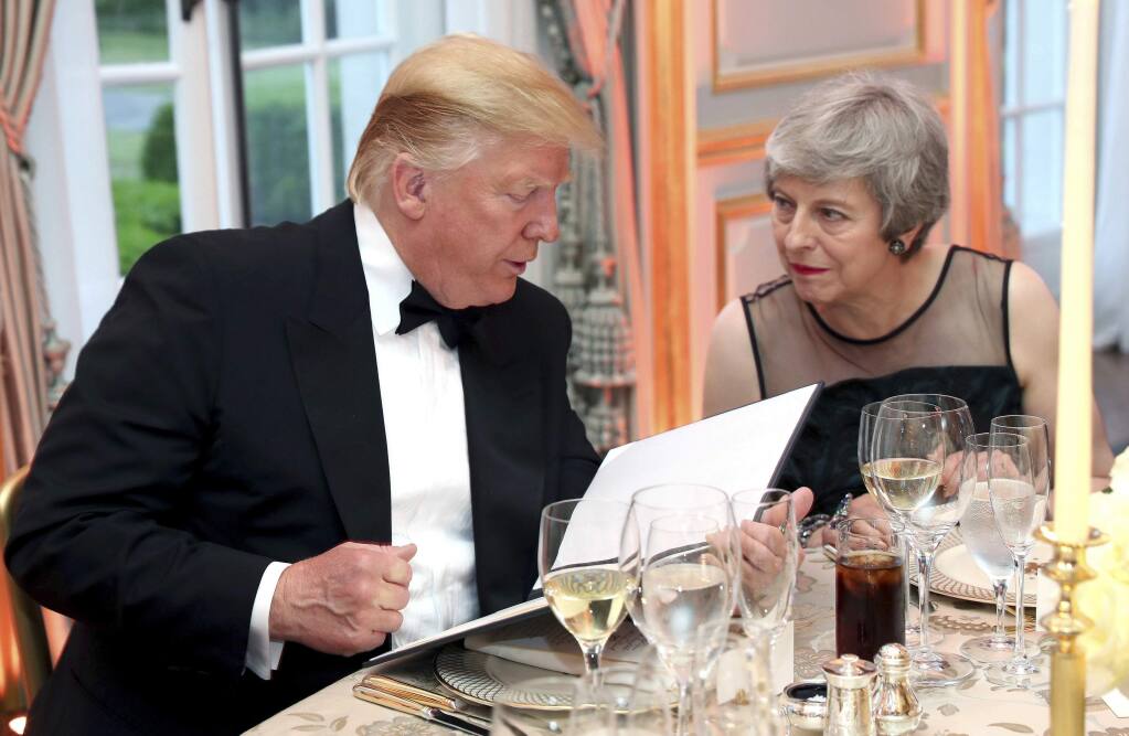 US President Donald Trump and Britain's Prime Minister Theresa May speak during the Return Dinner in Winfield House, the residence of the Ambassador of the United States of America to the UK, in Regent's Park, part of the president's state visit to the UK, in London on Tuesday, June 4, 2019. (Chris Jackson/Pool Photo via AP)