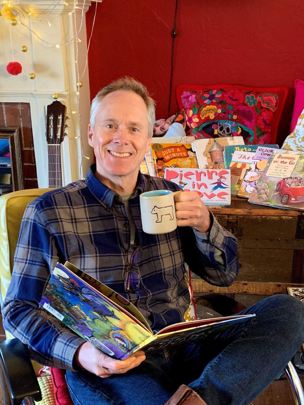 READY TO READ: Petaluma's Barton Smith, with book and cup of tea, preparing to read a story as part of his nightly Bedtime Stories with Barton broadcast on Facebook Live.